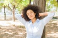 Smiling African Young Woman Dreaming With Closed Eyes In Nature Royalty Free Stock Photo
