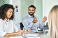 Smiling Afro American and indian managers discussing project at office meeting. Royalty Free Stock Photo