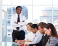 Smiling Afro-American manager with his team Royalty Free Stock Photo