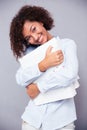 Smiling afro american woman standing with folders Royalty Free Stock Photo