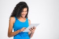 Smiling afro american woman using tablet computer