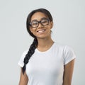 Smiling afro girl in eyeglasses posing over grey background Royalty Free Stock Photo