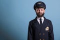 Smiling airplane pilot wearing uniform front view portrait