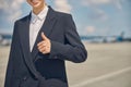 Smiling airport worker dressed in a jacket Royalty Free Stock Photo