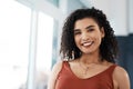 Smiling through all my goals. Cropped portrait of an attractive young businesswoman standing alone in her office during Royalty Free Stock Photo