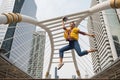 Smiling American engineer jump in city