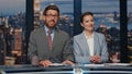 Smiling anchors broadcasting news at evening television media channel closeup Royalty Free Stock Photo