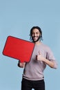 Man holding red blank banner and showing thumb up Royalty Free Stock Photo