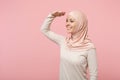 Smiling arabian muslim girl in hijab light clothes posing isolated on pink background. People religious lifestyle Royalty Free Stock Photo