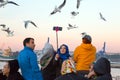 Smiling Arabic Ladies taking self Portrait with Sea Gulls