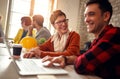 Smiling architect people working together at desk on computer Royalty Free Stock Photo