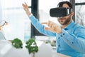 Smiling architect using VR headset while working on project Royalty Free Stock Photo