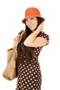 Smiling Asian American teen girl wearing brown polka dot dress Royalty Free Stock Photo