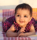 Smiling Asian baby girl looking at the viewer Royalty Free Stock Photo