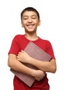 Smiling asian boy holding big book Royalty Free Stock Photo