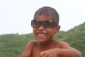 Smiling asian boy wearing sun glasses Royalty Free Stock Photo