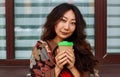 Smiling Asian Business Woman Having Coffee Break Near Office Royalty Free Stock Photo