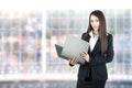 Asian business woman holding folder in office. Royalty Free Stock Photo