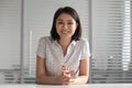 Smiling asian business woman looking at camera shooting video training Royalty Free Stock Photo