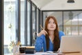 Young asian business woman or student working online on computer laptop. Royalty Free Stock Photo