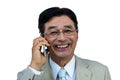 Smiling asian businessman phone calling Royalty Free Stock Photo