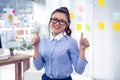 Smiling Asian businesswoman showing thumbs up Royalty Free Stock Photo