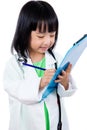 Smiling Asian Chinese Little Doctor Writting On Clip Board Royalty Free Stock Photo