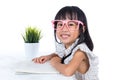 Smiling Asian Chinese little office lady reading book Royalty Free Stock Photo