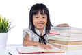 Smiling Asian Chinese little office lady reading book Royalty Free Stock Photo