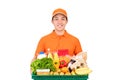 Smiling Asian delivery man holding grocery basket
