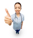 Smiling asian female doctor showing thumbs up Royalty Free Stock Photo