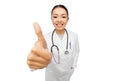 Smiling asian female doctor showing thumbs up Royalty Free Stock Photo