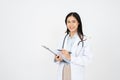 Asian female doctor woman in white medical gown hold clipboard isolated on white background Royalty Free Stock Photo