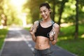 Smiling Asian Fitness Model Woman Posing With Jumping Rope Outdoors Royalty Free Stock Photo