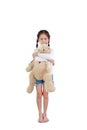 Smiling asian little child girl hugging a teddy bear doll standing isolated on white background Royalty Free Stock Photo