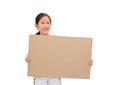 Smiling asian little girl holding empty brown big board for media banner isolated on white background with copy space Royalty Free Stock Photo