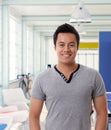 Smiling asian man at modern office Royalty Free Stock Photo
