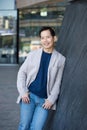 Smiling asian man posing outdoors Royalty Free Stock Photo