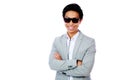 Smiling asian man standing with arms folded Royalty Free Stock Photo