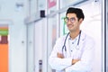 Smiling Asian medical doctor with stethoscope in hospital Royalty Free Stock Photo