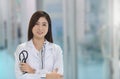 Smiling Asian medical doctor woman with stethoscope in hospital Royalty Free Stock Photo