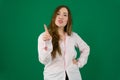 Smiling Asian nurse get and idea, closeup woman portrait isolated on green background.