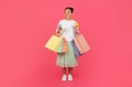 Smiling asian shopper woman with shopping bags, smartphone, and credit card Royalty Free Stock Photo