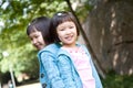 Smiling asian twin girls