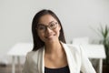 Smiling asian woman in glasses looking at camera, headshot portr Royalty Free Stock Photo