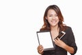 Smiling asian woman Is holding a cell phone and touchpad in a Royalty Free Stock Photo