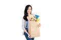 Smiling Asian woman holding grocery shopping bag Royalty Free Stock Photo