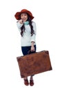 Smiling Asian woman holding luggage pointing the camera Royalty Free Stock Photo