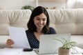 Smiling asian woman pay bills using easy banking on laptop Royalty Free Stock Photo