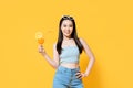 Smiling Asian woman in summer outfit with a glass of orange juice Royalty Free Stock Photo